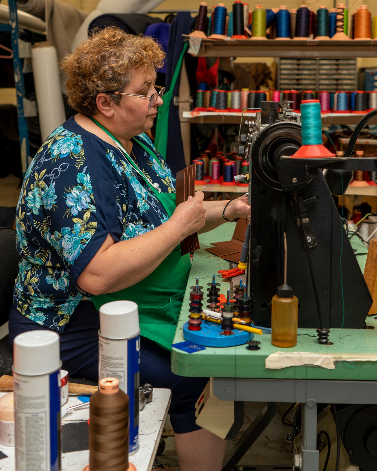 woman making alligator wallet